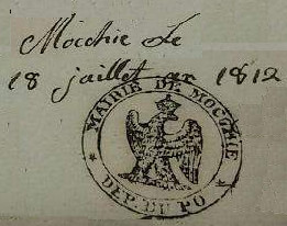 Timbro del Comune di Mocchie in uso sui documenti nel periodo 1800/1814 quando il territorio del ducato si Savoia era stato occupato dai francesi, suddiviso in sei dipartimenti e incorporato nel territorio francese
